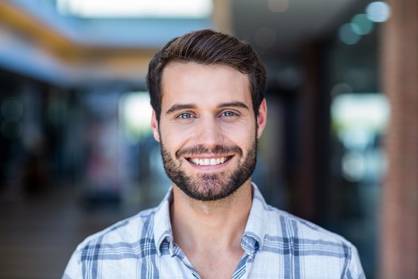 man smiling indoors