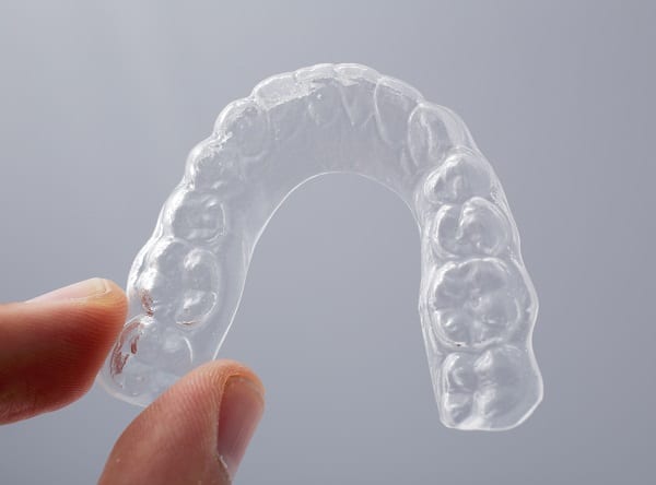 Clear plastic Essix retainer to wear after Invisalign treatment