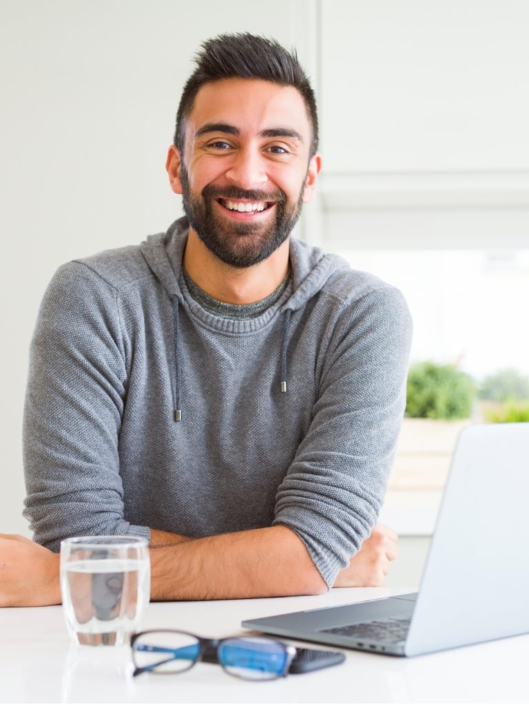 handsome hispanic man working using computer laptop with a happy and picture id1158259581