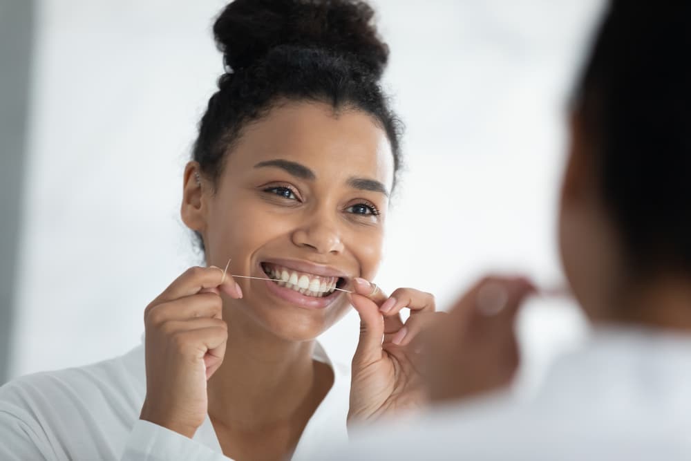 Woman flossing