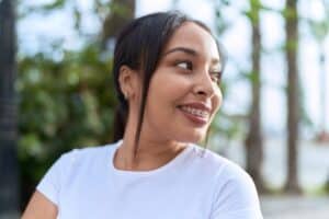 A profile shot of a woman with braces in Denver, CO