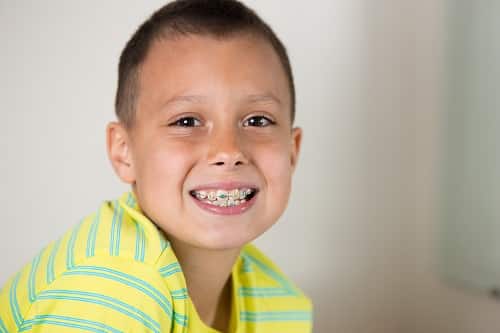 Boy brushing his teeth.