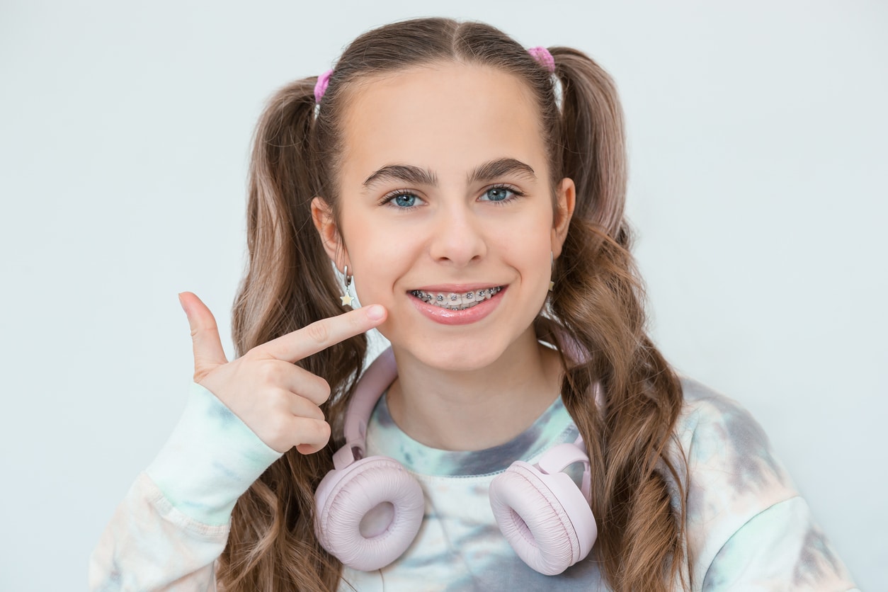 Teen girl smiling with braces in Denver, CO